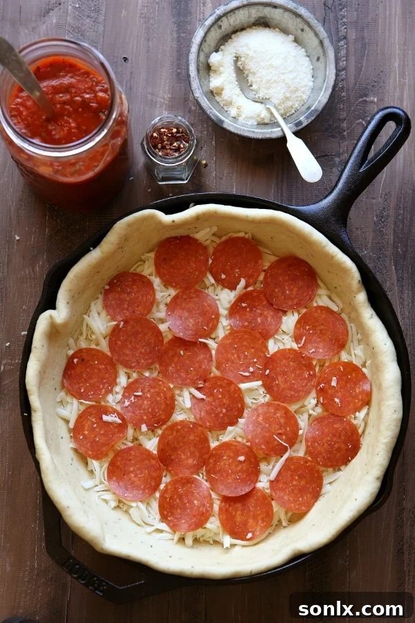 Deep Dish Skillet Pizza before baking, showing layers