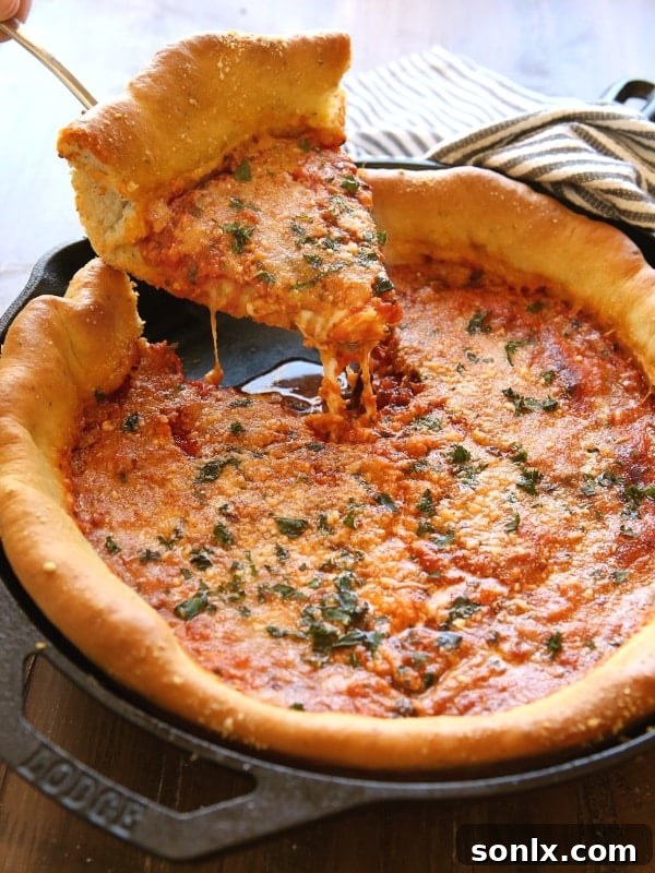 Close-up of baked Deep Dish Skillet Pizza with bubbly cheese and sauce