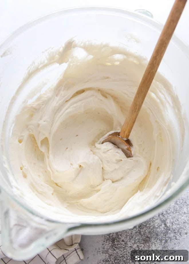 Close-up of the fluffiest whipped vanilla frosting texture
