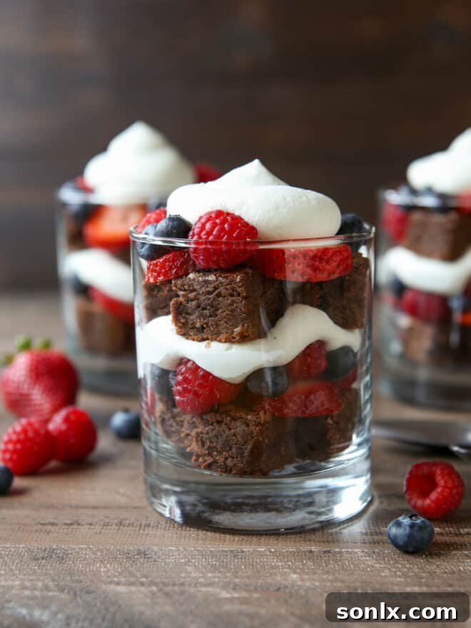 Berry Brownie Bliss Trifle 5 Individual brownie berry trifles expertly layered in clear glasses, ready to be served.