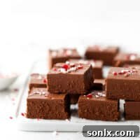 A delicious stack of peppermint fudge squares on a plate