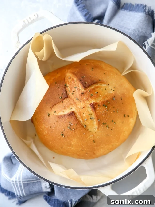 Bake this easy herb bread loaf in your dutch oven for a crispy crust!