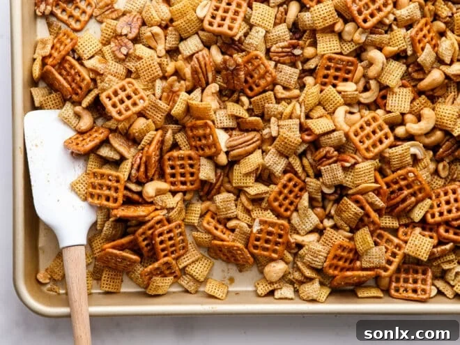stirring snack mix while baking