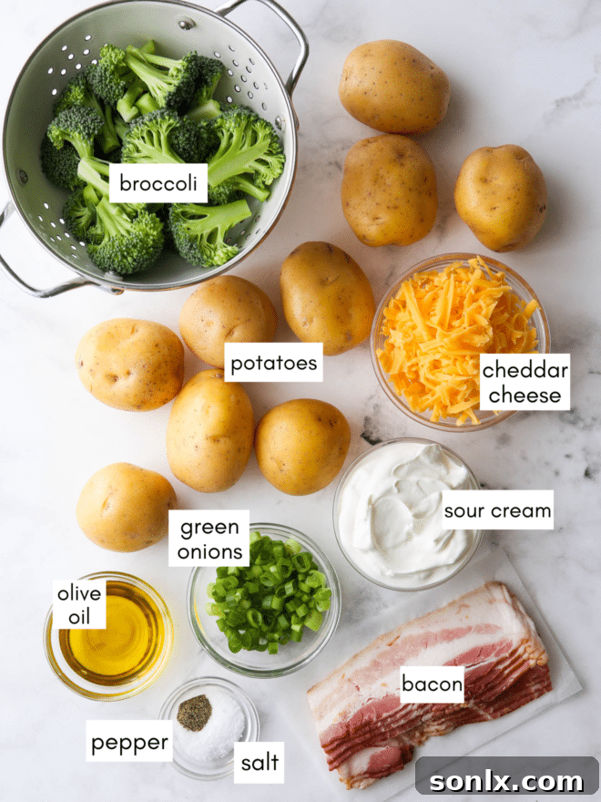 A selection of ingredients for the baked potato sheet pan dinner, including gold potatoes, broccoli, bacon, cheese, sour cream, and green onions.