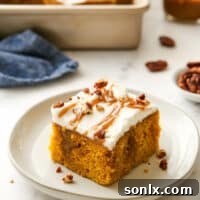 slice of pumpkin caramel poke cake on plate