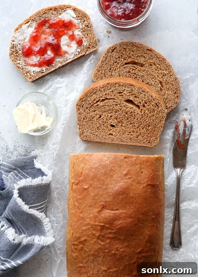 Flour Power: The Science Behind Perfect Baking 4 A rustic and hearty loaf of bread made with 100% whole wheat flour, showing a rich brown crust and dense texture
