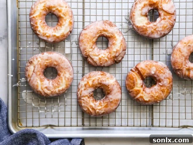 glazed old fashioned doughnuts on a wire rack
