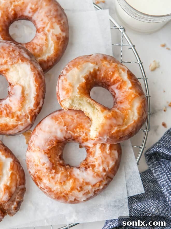 bite taken out of old fashioned doughnuts