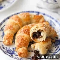 closeup of puff pastry chocolate croissants on a plate