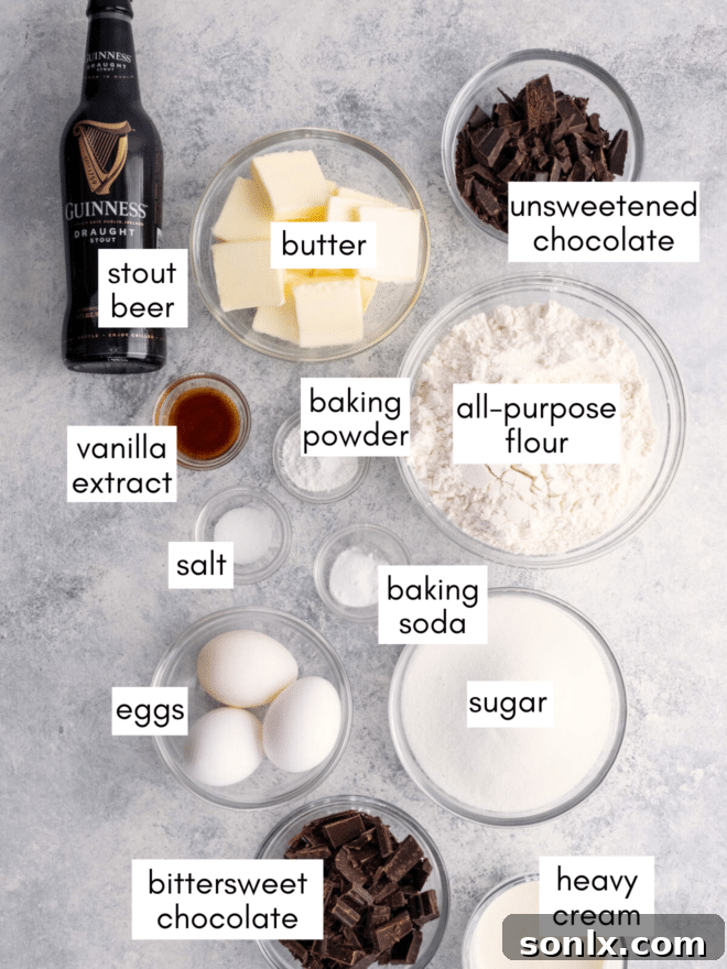 A selection of high-quality ingredients, including chocolate, flour, butter, eggs, and stout beer, prepared for baking.