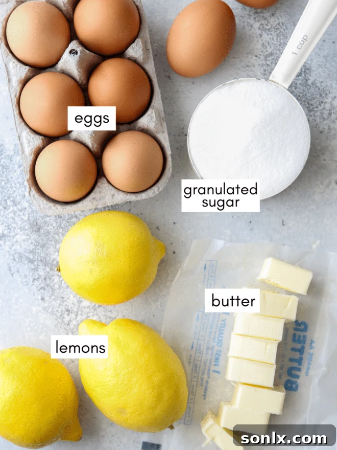 A selection of fresh lemons, butter, eggs, and sugar - the simple ingredients for homemade lemon curd.