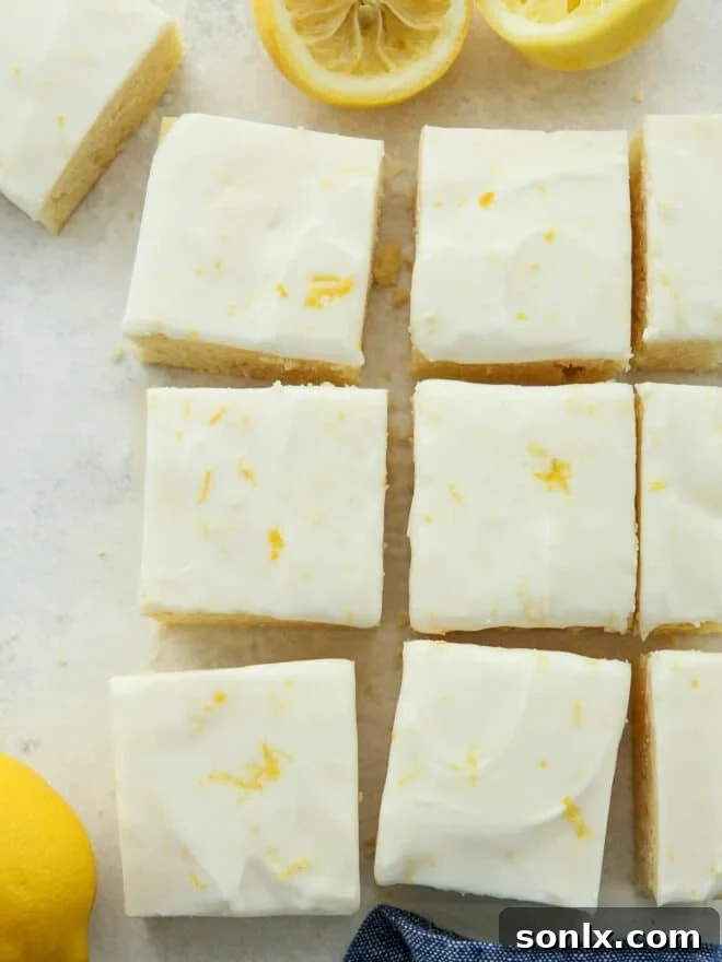 Perfectly sliced lemon cookie bars on a plate