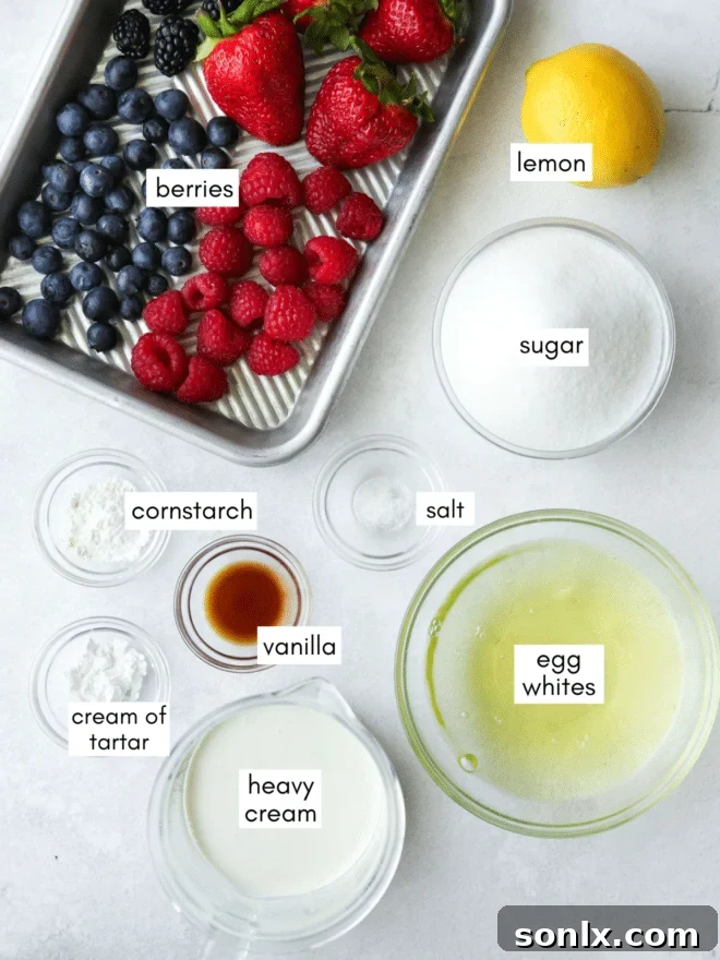 Various ingredients laid out for mixed berry pavlova preparation