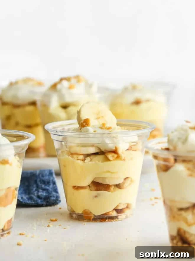 many individual banana pudding cups on counter