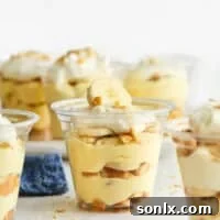 many individual banana pudding cups on counter