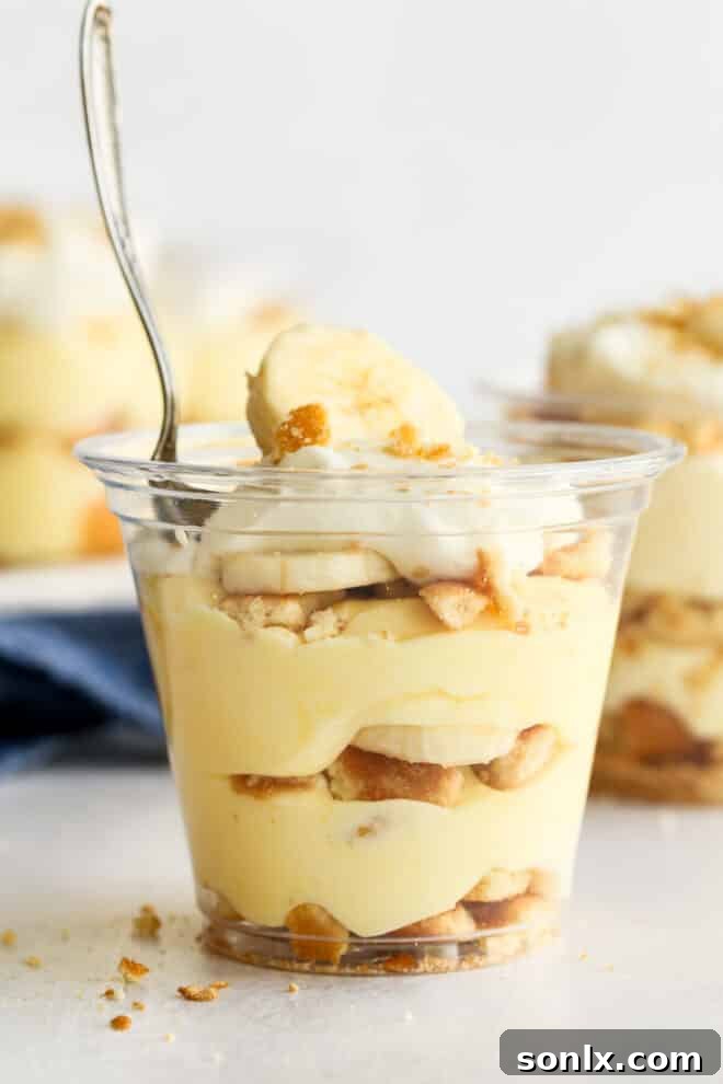 single banana pudding cup with a spoon in it