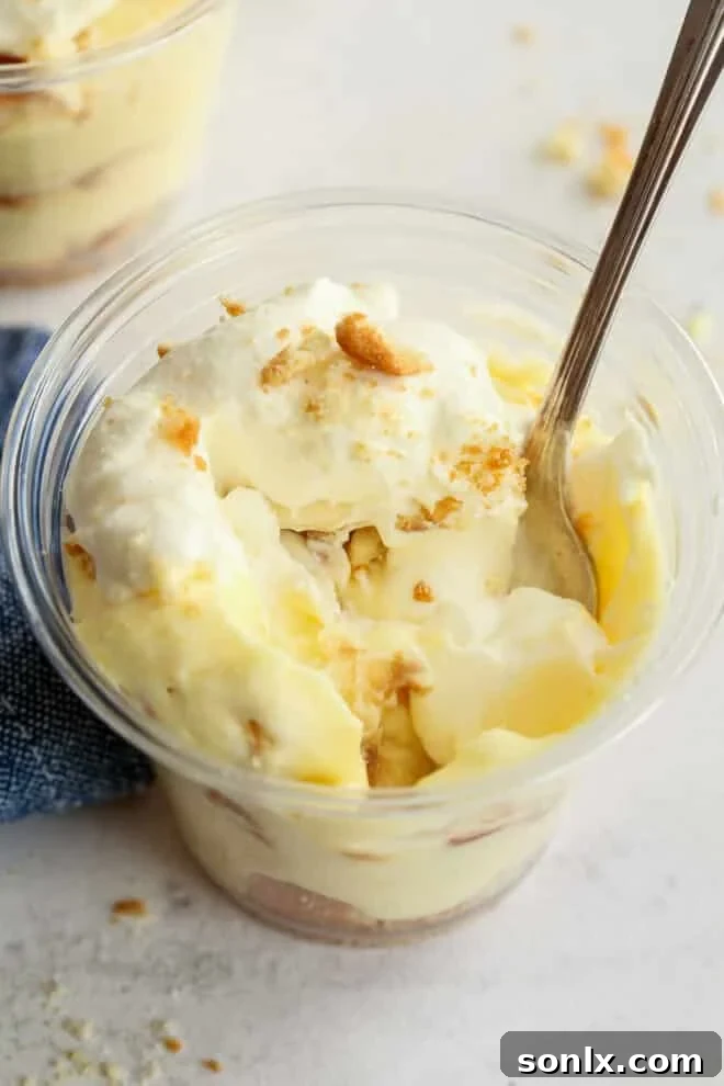 messy bite taken out of a banana pudding cup